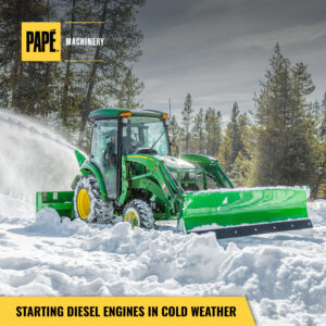 Pape Machinery cold weather John Deere machine in snow.