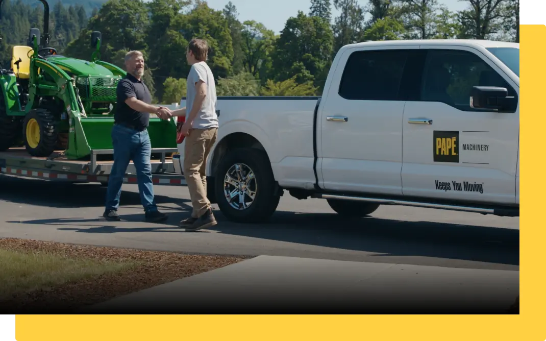 Man shaking hands in front of truck