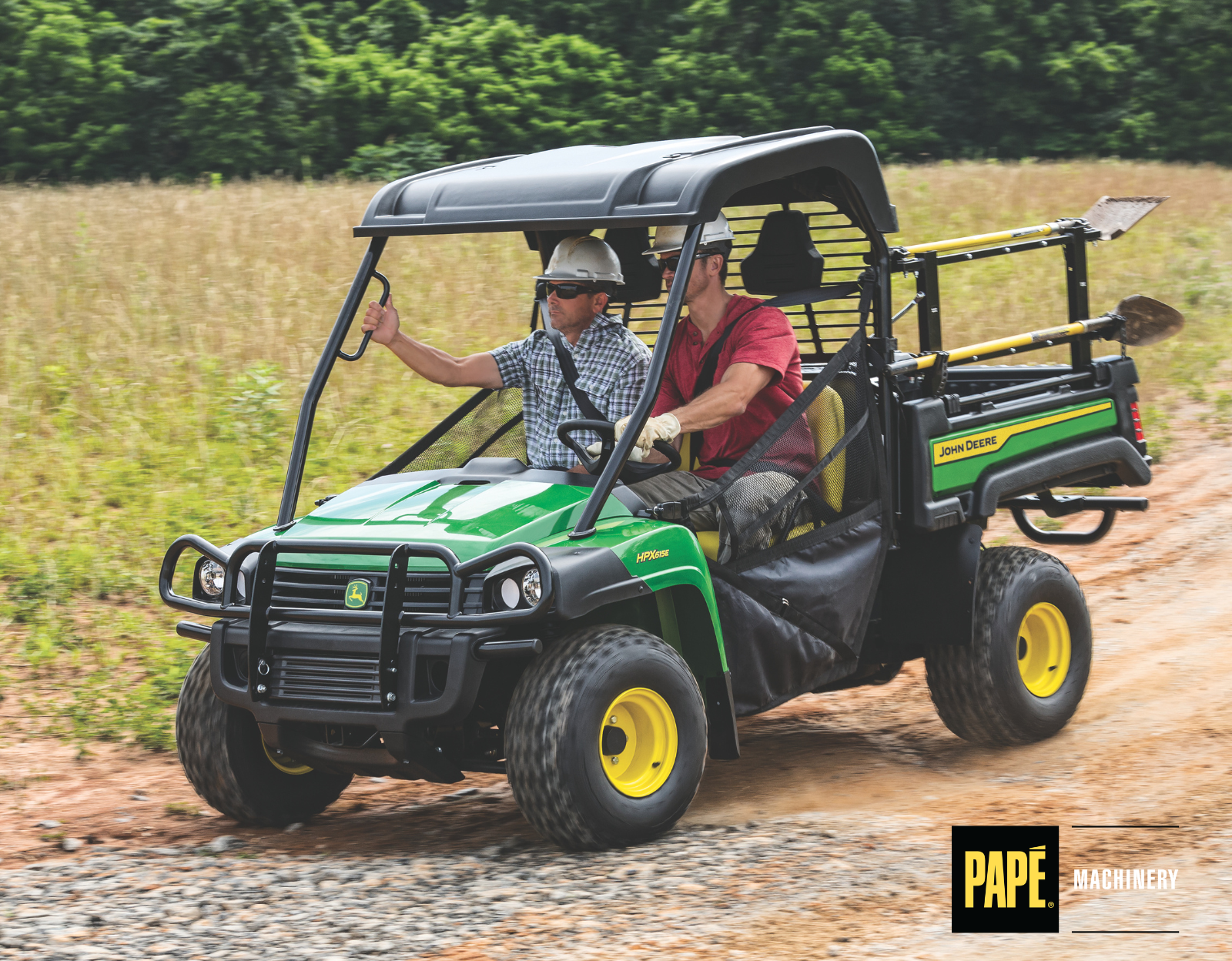 John Deere Gator UTV operating on rough farm terrain to support hauling and field maintenance