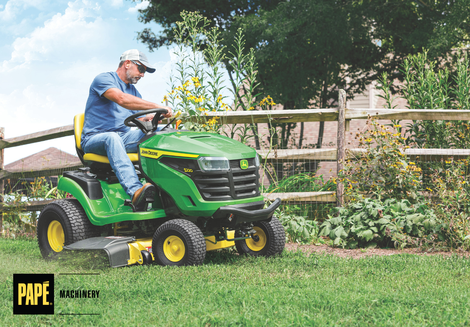 John Deere riding mower cutting a healthy green lawn during summer to support proper lawn maintenance and turf health