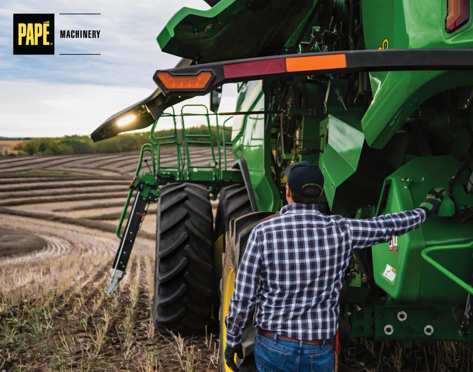 John Deere combine receiving preventive maintenance before harvest to improve equipment uptime and field productivity