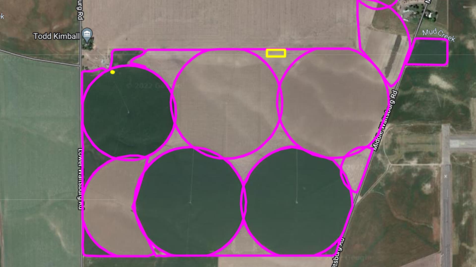 Aerial map showing property boundaries outlined in magenta with six circular pivot irrigation systems and connecting roads near Todd Kimball and Mud Creek.