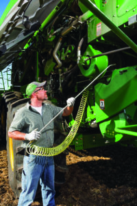 John Deere combine receiving preventive maintenance before harvest to improve equipment uptime and field productivity