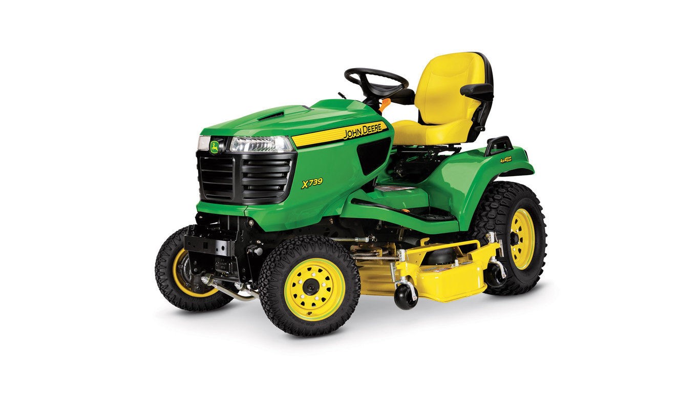Green and yellow riding lawn mower with yellow seat and front-mounted cutting deck, shown from the side against a white background.