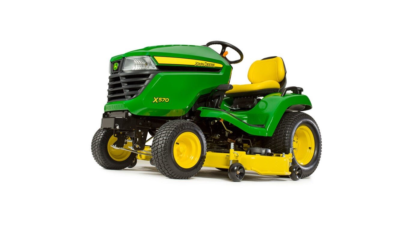 Green and yellow lawn mower with yellow seat and steering wheel, featuring a yellow cutting deck underneath.